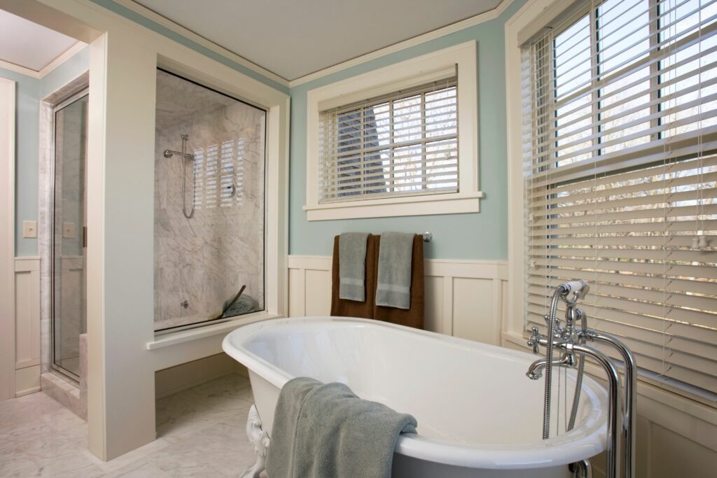An example of bathroom remodels on a budget with fresh paint and a new tub