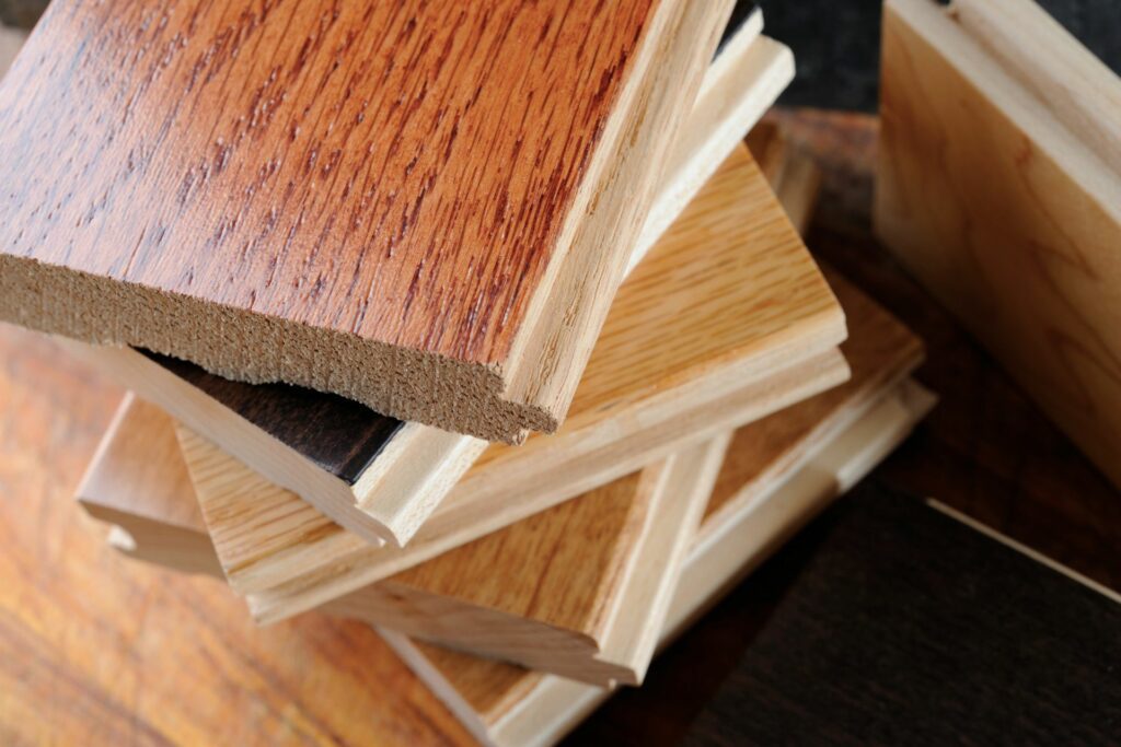 A variety of the types of hardwood flooring in a stack of samples